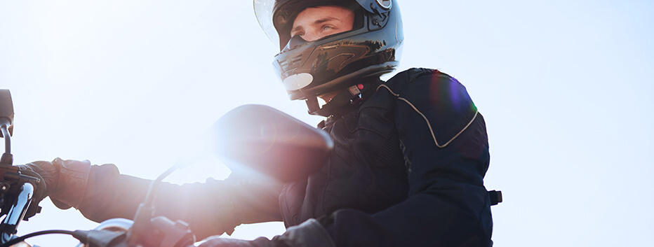 Motorcyclist wearing helmet