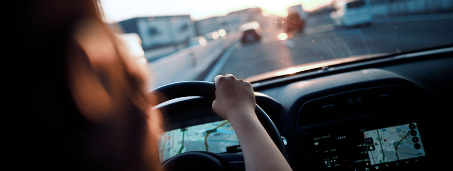 Woman driving car on freeway