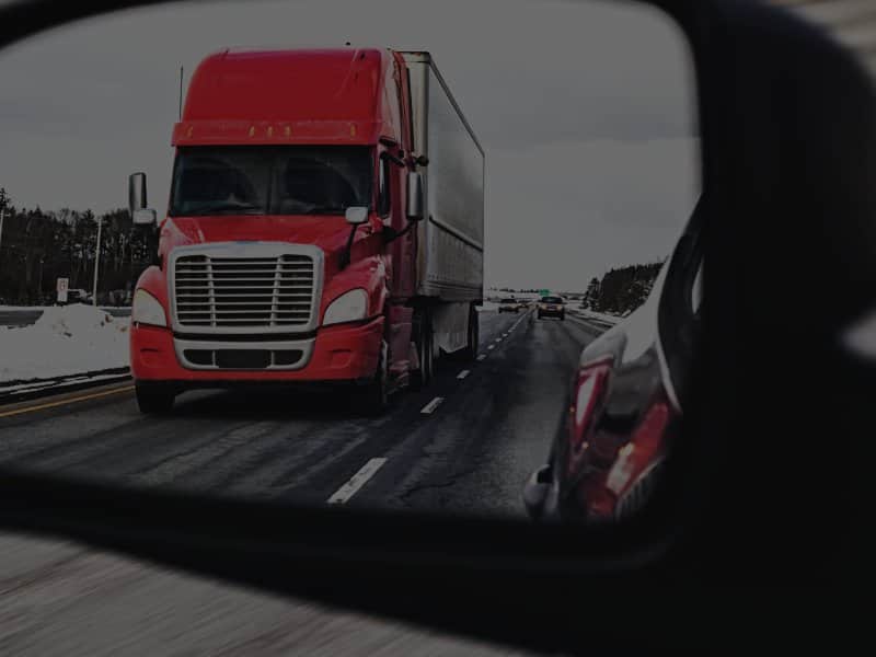 Semi-truck driving on freeway